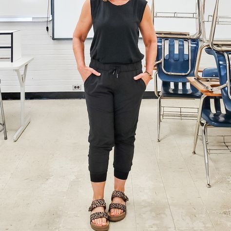 Casual summer dressy comfortable look featuring a muscle sleeveless tank top,  Lululemon joggers, and leopard print sandals. Looks like a jumpsuit, but it's not: perfect for travel or teacher outfit #summer #teacher #jumpsuit #joggers #black #leopard Black Tank Top Outfit Summer, Chromebook Storage, Black Tank Tops Outfit, Summer Tank Top Outfits, Classroom Procedures, Lululemon Joggers, Tank Top Outfits, Teacher Outfit, Lululemon Tops