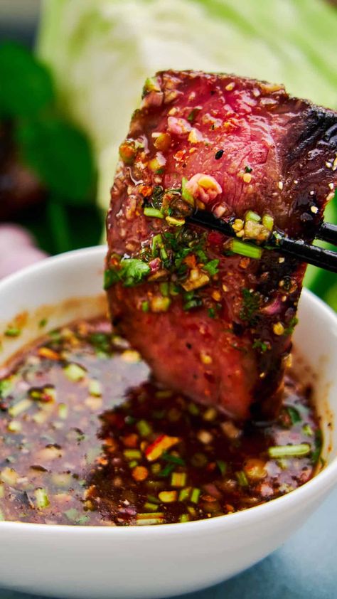 Dipping a medium rare slice of Crying Tiger Beef in spicy Nam Jim Jaew, a spicy tangy and savory Thai BBQ sauce that's addictively good. Crying Tiger Beef, Grilled Beef, Asian Cooking, Beef Dishes, Asian Dishes, Bbq Recipes, Food App, Chopsticks, Farmers Market