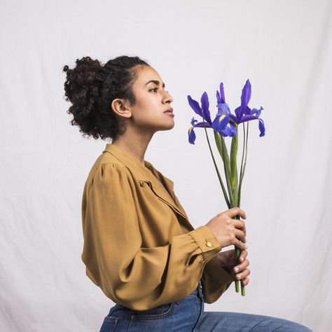 Thoughtful black woman holding blue flow... | Free Photo #Freepik #freephoto #freebackground #freeflower #freewoman #freegreen Side Profile Holding Something, Person Holding Flower Reference, Holding A Flower Reference, Person Holding Flowers Drawing Reference, Holding Flowers Pose Reference, Woman Holding Something, Holding Something Pose, Basil Drawing, Holding Flowers Pose