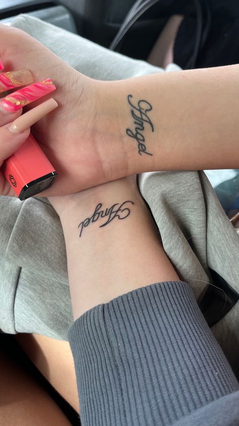 Angel Wrist Tattoo, Name Font Tattoo Ideas, Angel Cursive Tattoo, Angel Name Tattoo Fonts, Angel Lettering Tattoo, Wrist Tattoo Writing, Angel Word Tattoo, Angel Name Tattoo, Angel Hand Tattoo