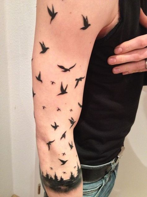 Feathered Ink: The Rise of Bird Tattoos Among Men 2023 - mens-club.online Color Bird Tattoo, Bird Tattoo Sleeves, Bird Tattoos Arm, Rabe Tattoo, Bird Tattoo Men, Crow Tattoo Design, Vogel Tattoo, Forearm Band Tattoos, Armband Tattoo Design