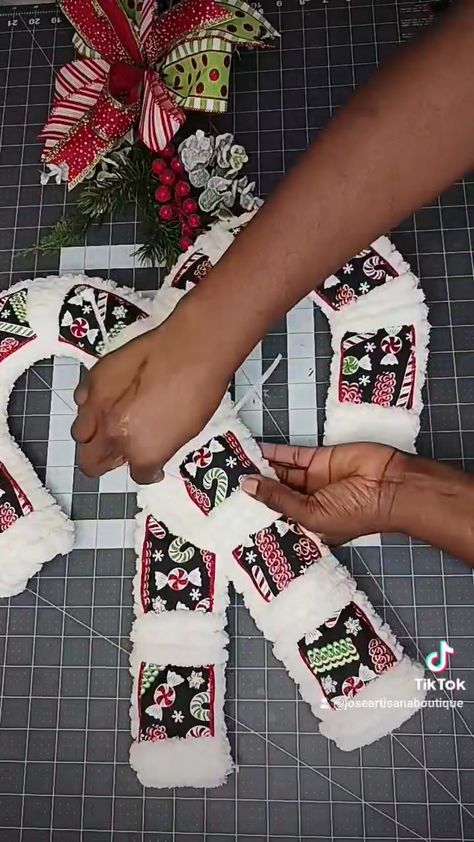 Candy Cane Wreaths Diy How To Make, Candy Cane Dollar Tree Diy, Dollar Tree Candy Cane Diy, Diy Candy Cane Wreath Tutorials, Dollar Store Candy Cane Wreath, Candy Cane Wreath Form Ideas, Dollar Tree Christmas Swags Diy, Dollar Tree Candy Cane Wreath Diy, Grinch Candy Cane Wreath