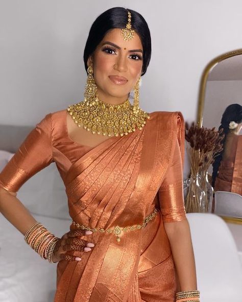 Toronto Makeup Artist on Instagram: "Absolutely radiant Dharshie, loved her @muhurtham__ saree that looked gorgeous in every single light. Couldn’t get enough of the terracotta & rose gold zari on her caramel complexion MUAH & Draping @imsylvie Saree @muhurtham__ Jewelry @mayasboutique Flowers @jasmineflorists . . . . . . . . . . . #torontomakeup #torontomakeupartist #torontomua #bridalmakeup #tamilmakeupartist #tamilmua #tamilbride #indianbride #southasianbride #tamil #weddingmakeupartis Anushree Reddy Lehenga, Bridal Jewelry Ideas, Indian Dress Up, South Indian Bride Saree, Engagement Saree, Indian Wedding Gowns, Bridal Sarees South Indian, Mehendi Outfits, Tamil Brides