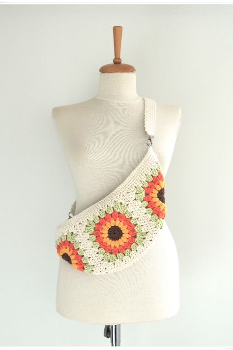 This bum bag you will ever need. Do you love bohemian style? Look no further, this sunflower bag is just the thing! This crochet purse is hand crocheted with cotton yarn.
Fanny Bag fits a standard wallet and phone. Chest bag lined and zipped so your lipstick won’t fall out.

This hobo bag crossbody is perfect for festival bag, or an everyday boho chic look.This patchwork bag has vibrant colours.
Sling bag for women made from 100% cotton yarn, cotton linen. Crochet Bum Bag, Sling Bag Crochet, Sunflower Bag, Crochet Sling Bag, Crochet Hot Pads, Crochet With Cotton Yarn, Crochet Bag Tutorials, Mode Crochet, Granny Square Bag