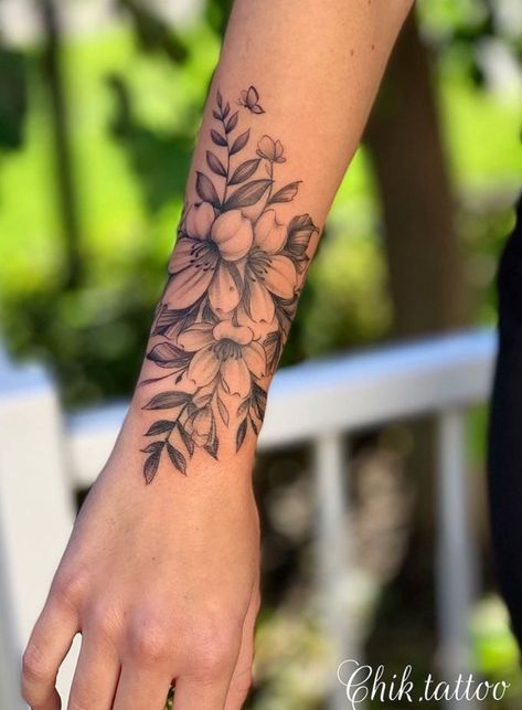 Violet Flower Tattoos, Lower Arm Tattoos, Wrap Around Tattoo, Cuff Tattoo, Wrap Tattoo, Girl Arm Tattoos, Flower Wrist Tattoos, Inspired Tattoos, Flower Tattoo Arm