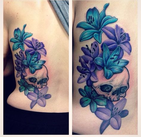 Skull and lily back tattoo. Colourful purple and blue lily with black and grey shade back tattoo. Skull And Lilies Tattoo, Purple Lillies Tattoo, Blue And Purple Rose Tattoo, Kindered Spirts, Blue And Purple Flower Tattoo, Purple And Blue Tattoo, Blue Lily Tattoo, Purple Tattoo Ideas, Lily Back Tattoo