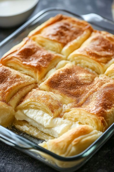 Enjoy a twist on traditional cheesecake with Crescent Rolls Cheesecake, featuring crescent roll dough as a flaky crust, filled with a creamy cheesecake center. It’s an inventive dessert that’s as fun to make as it is to eat. #CrescentCheesecake #UniqueDessert #BakeAndEnjoy Pillsbury Crescent Dinner Recipes, Empanadas With Crescent Rolls, Cheesecake With Crescent Roll Crust, Sopilla Cheesecake Crescent Rolls, How To Make Crescent Rolls, Recipes Using Crescent Rolls Breakfast, Crescent Roll Pie Crust, Cheesecake Crescent Rolls Recipes, Cresent Roll Cheesecake