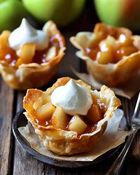 These Mini Apple Pie Wonton Cups bring the classic flavors of apple pie into a crispy, bite-sized treat that’s perfect for any gathering. The combination of tender, cinnamon-spiced apples nestled ... Read more Mini Apple Pies In Muffin Tin, Mini Apple Crumble, New Years Desserts, Mini Apple Pie, New Year's Desserts, Wonton Cups, Mini Apple Pies, Dessert Bites, Bite Size Desserts