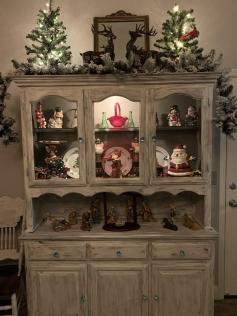 Hutches Decorated For Christmas, China Cabinet Christmas Decorating Ideas, Curio Cabinet Christmas Decor, How To Decorate A Hutch For Christmas, Christmas China Cabinet, Top Of Hutch Christmas Decor, Kitchen Hutch Christmas Decor, Christmas Decor On Top Of Hutch, China Cabinet Decorated For Christmas