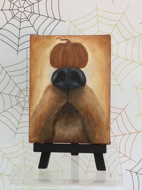 "A whimsical Halloween pup and his pumpkin!  The complete balancing act!  This mini hand painted canvas shows the skill this dog has for the holiday!  The 3\" x 4\" mini  canvas is  hand painted with acrylics, and sealed with varnish for protection.  An easel is provided with your purchase.   Enjoy all of my Halloween pieces by following this link, right here in my etsy store!  https://www.etsy.com/shop/GinnyDiezelStudios?section_id=12141321  #ginnydiezelstudios I create all of my artwork in  my Halloween Art On Canvas, Acrylic Painting Ideas Halloween, Small Halloween Canvas Paintings, Halloween Painting Simple, Easy Harvest Painting, Halloween Painting Watercolor, Halloween Mini Painting, Mini Canvas Art Fall, Fall Paintings On Canvas