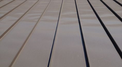 11 Reasons You Shouldn't Buy a Standing Seam Metal Roof - Sheffield Metals Metal Roofing As Siding, Shingles And Metal Roof Combination, Seamless Metal Roof, Cottage Metal Roof, Standing Seam Metal Siding, Exterior House Colors With Metal Roof, Standing Seam Metal Roof Colors, Light Metal Roof, Dark Bronze Metal Roof