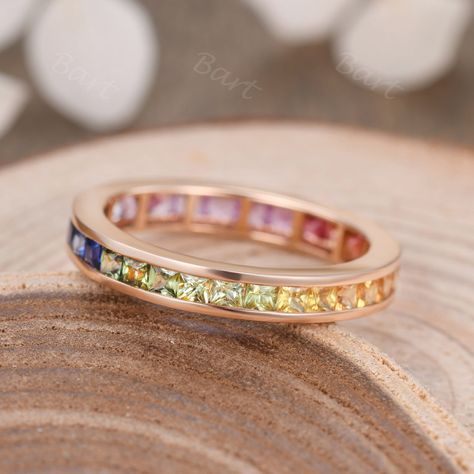 Channel Set Rainbow Band Eternity 2mm Princess Colored Sapphire 14K Gold Wedding Band Pride Sapphire Stacking Ring Multi Sapphire Ombre Ring ◆ Product Specifications ※18K Rose gold ※Rainbow Color Natural Sapphire, 2.0mm Princess Cut,Shades of red, orange, yellow, green, blue, purple, and pink ※Gemstone Clarity:VS1 ※Setting: Channel Set ※Made in the USA ★Procedure information Please select the style, material, and size from the drop-down menu on the right side of the listing. If you have any spec Rainbow Rings Jewelry, Sapphire Wedding Ring Set, Ombre Rings, Birthstone Band, Rainbow Band, Stacked Wedding Bands, 14k Gold Wedding Band, Sapphire Wedding Rings, Sapphire Wedding Band