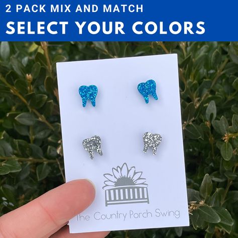 Can't choose just one color of these adorable tooth stud earrings? That's okay, now you can mix and match your colors and purchase as a pack of 2! Any pair of solid or glitter tooth studs in the shop are available for mixing and matching. (Tie Dye and Smiley tooth not included) To order, purchase listing and in note include which colors you would like. Please use the color names I have in the titles of the listings in the shop so I know exactly which ones you want. If you're not sure, please fee Tooth Earrings, Dental Jewelry, Dental Hygienist Gifts, Dental Gifts, Dental Student, Gifts For Dentist, Small Jewelry Box, Dental Hygienist, Dental Assistant