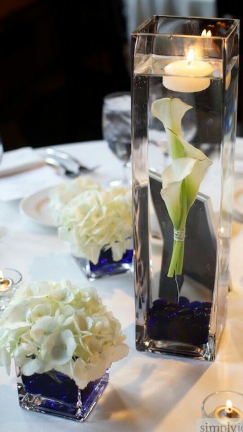 I also like the look of the flowers in in the water Simple Elegant Centerpieces, Receptions Ideas, White And Blue Wedding, Navy Ball, Blue Wedding Centerpieces, Blue Centerpieces, Centerpieces Ideas, Galaxy Theme, Table Centrepiece