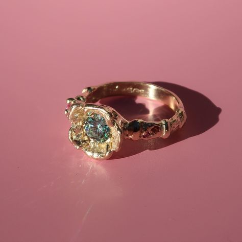 A recent bespoke wedding ring for Chau. A beautiful unison of blue moissanite & pink sapphires ✨ Luxury Pink Gold Sapphire Ring, Luxury Pink Sapphire Ring, Luxury Pink Sapphire Ring With Rose Cut Diamonds, Luxury Pink Sapphire Ring With Bezel Setting, Luxury Pink Sapphire Gold Jewelry, Flower Wedding Ring, Blue Moissanite, Garden Jewelry, Bespoke Jewellery