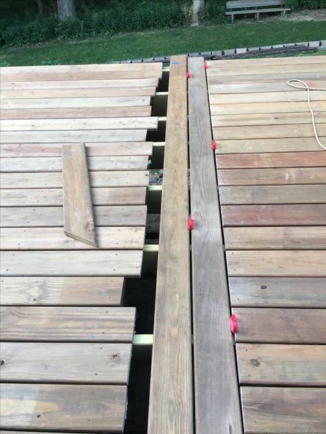 Install 3 middle deck boards May-June 2017. AC2 cedartone deck boards from Menards. DIY Deck Renovation 2017. Dryfit and install middle deck boards May-June 2017. Deck at its longest length is 26.5 feet by 12.5' wide. Split the deck in two, separated by 3 12.5' boards. Staggered Deck Boards, Diy Deck Decor, Building A Floating Deck Ground Level, Low Wood Deck Ground Level, Replacing Deck Boards, 12x12 Deck Plans Lowe's, Cabin Deck, Wooden Fence Gate, Deck Renovation