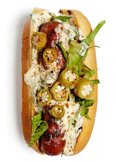 Grilled hot dogs on grilled buns with remoulade sauce or Creole mustard, shredded romaine and pickled okra. Sprinkle with Creole seasoning. Sausage On A Bun, Chicago Dogs, Grilled Hot Dogs, Creole Mustard, Grilling Hot Dogs, Gourmet Hot Dogs, Hot Dog Toppings, On A Bun, Pickled Okra