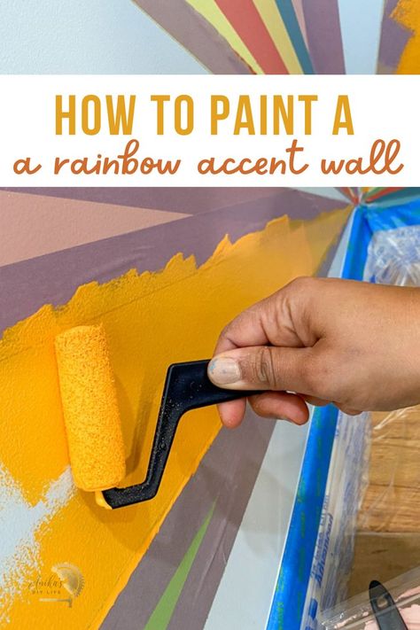 Not your traditional rainbow accent wall! Paint it in a corner. Use colors that match the room decor for a colorful sunburst rainbow accent wall that is modern and fun! #anikasdiylife Multi Colored Accent Wall, Rainbow Slat Accent Wall, Colourful Mural, Sunburst Painted Wall, Playroom Wall Paint Ideas, Rainbow Paint Wall, Paint Rainbow On Wall Diy, Rainbow Painted Walls, Rainbow Corner Accent Wall