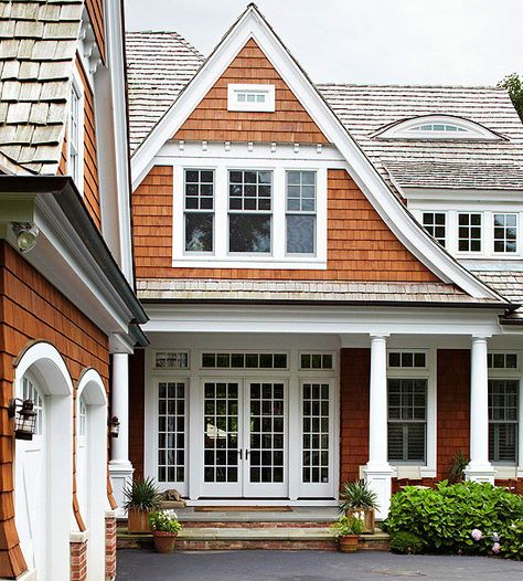 We love the contrast of warm stained wood and sleek white trim on this cottage-style home. See more of our favorite exterior color schemes: http://www.bhg.com/home-improvement/exteriors/curb-appeal/best-exterior-house-color-schemes/?socsrc=bhgpin040813stainedshingles=9 Exterior House Color With White Windows, House Siding Options, Home Exterior Colors Schemes, Shaker Siding, Exterior Siding Options, Exterior Windows, Siding Options, Gorgeous Homes, Cedar Shakes