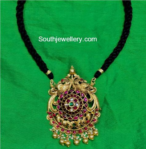 Black dori necklace with peacock kundan pendant by Hiya Designer Jewellery. Black Thread Jewellery Indian, Black Beads Mangalsutra, Pure Gold Jewellery, Designers Jewelry Collection, Antique Gold Jewelry Indian, Peacock Pendant, Gold Jewelry Simple Necklace, Gold Mangalsutra Designs, Beautiful Gold Necklaces