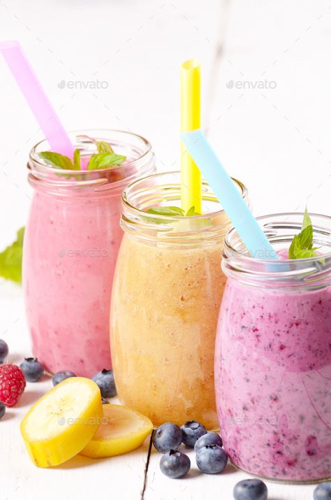 Assorted fruit shakes on white table by e_mikh. Assorted fruit shakes on white table. Smoothie concept#shakes, #white, #Assorted, #fruit Fruit Shake Photography, Shake Photography, Fruit Shake, Pika Pika, Food Drink Photography, Creative Icon, Design Graphics, White Table, Icons Design