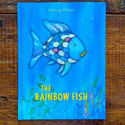 This 1990s childhood classic might bring fond memories for some, but one teacher has sparked a reexamination of its message. The post Here’s Why This Teacher Says the Book “Rainbow Fish” Might Be Outdated appeared first on Reader's Digest. Rainbow Fish Book, The Rainbow Fish, Fauna Marina, Classic Childrens Books, Rainbow Fish, Beautiful Fish, Big Book, Board Books, Foil Stamping