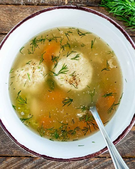 This Matzo Ball Soup is an exceptionally delicious Jewish dish made with matzah meal dumplings. One sip and and you will be hooked! #matzo #matzoballs #soup #recipe Chicken Matzo Ball Soup Recipe, Matzah Ball Soup Recipe, Matzo Ball Recipe, Matzo Ball Soup Recipe, Matzah Ball Soup, Kielbasa Soup, Matzo Balls, Kid Friendly Meals Dinner, Matzah Ball