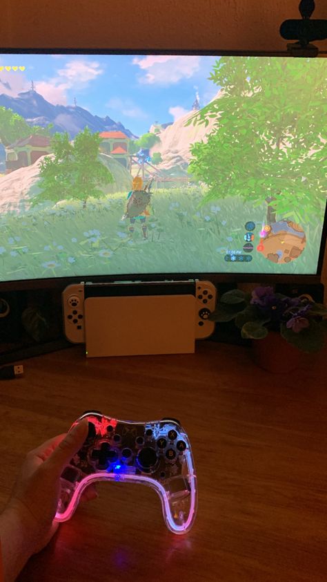 Cozy gaming night playing Zelda: Breath of the wild on the white nintendo switch oled with a transparent rgb controller Nintendo Switch Oled Aesthetic, Nintendo Switch Wallpaper, White Nintendo Switch, Nintendo Oled, Nintendo Switch Zelda, Gaming Aesthetic, Cozy Gaming, Switch Games, Nintendo Switch Oled