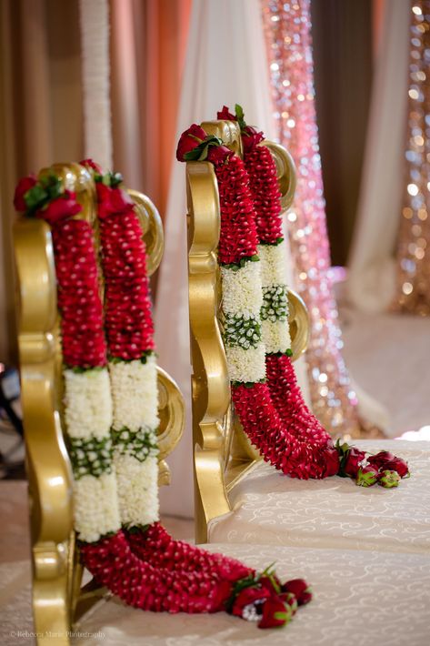 Aon Ballroom Wedding - Hindu celebration - Rebecca Marie Photography  Esha & Kapil's wedding at Aon Ballroom and Navy Pier in Chicago featured gorgeous traditional details, friends and family coming together, and a color palette of blush, bright pink, turquoise, magenta, and ruby. Hindu Wedding Mala, Pink Stage Decorations, Marriage Malai Design, Hindu Wedding Garland, Wedding Malai Design, Marriage Garlands, Varmala Indian Weddings, Garland Wedding Indian, Garlands For Wedding