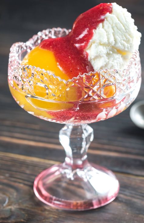 Impossibly Delicious Peach Melba?utm_source=12tomatoes Peach Melba Recipe, Poached Peaches, Peach Melba, Peach Salsa, Berry Sauce, Peach Desserts, Raspberry Sauce, Vanilla Bean Ice Cream, Flavored Syrup