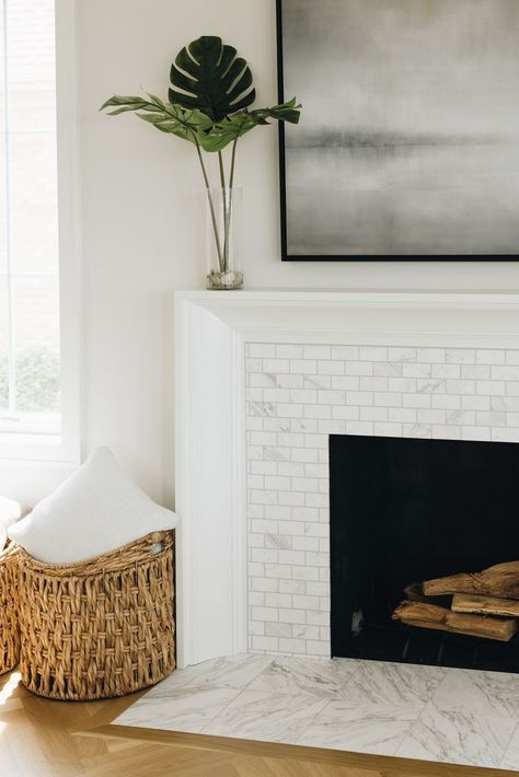 Design by Timber Trails.​ Photo by Stoffer Photography.​​ Tile featured: Volakas Honed Marble Amalfi + 12x12in. Fireplace Feature Wall, Inset Fireplace, Fireplace Tile Surround, White Fireplace, The Tile Shop, Fireplace Remodel, Fireplace Makeover, Marble Fireplaces, Living Room Spaces