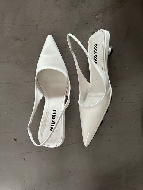 Miu Miu heels laying on the floor Miu Miu Footwear, White Office Shoes, Miu Miu White Shoes, Heals For Graduation, White Miu Miu Heels, Miu Miu Wedding Shoes, Pointed Heels Aesthetic, White Kitten Heels Aesthetic, Kitten Heel Shoes Classy