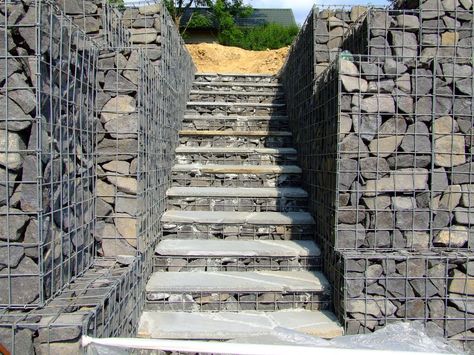 Gabion Stairs | Gabions can also be used as foundations under garages on steep slopes Gabion Stairs, Staircase Landscape, Barn Exterior Ideas, Timber Steps, Gabion Wall Design, Steep Gardens, Gabion Stone, Retaining Wall Steps, Gabion Retaining Wall