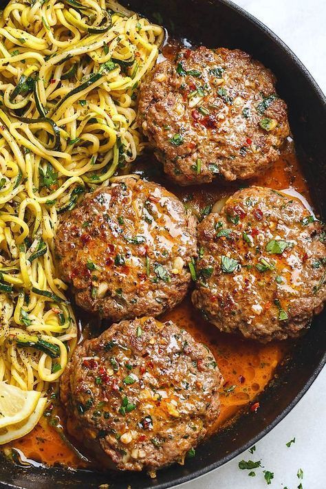 Cheesy Garlic Burgers with Lemon Butter Zucchini Noodles Garlic Burgers, Butter Zucchini, Burger Steak, Sliced Onion, Hamburger Patties, Lemon Butter, Idee Pasto Sano, Zucchini Noodles, Onion Soup