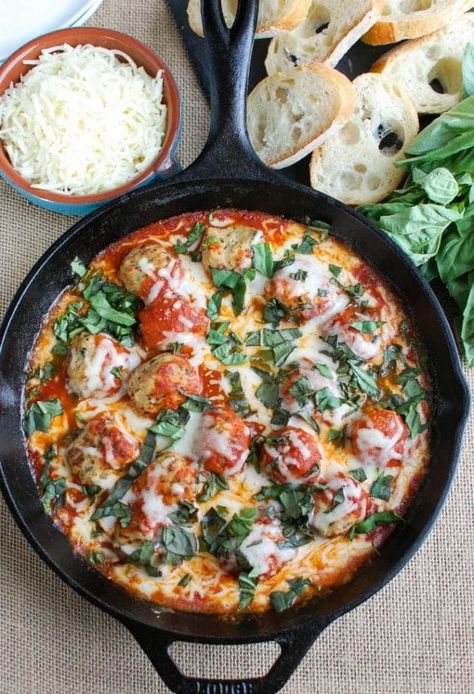 This Skillet Tomato Basil Meatballs is warm, cheesy and the perfect appetizer for a party, game day or for your family to enjoy. Tomato basil meatballs are cooked in a rich tomato sauce and topped with gooey, warm cheese and fresh basil. Pair it with warm baguette to create the perfect bite sized appetizer! Basil Meatballs, Low Fat Chicken Recipes, High Protein Low Carb Diet, Tomato Basil Chicken, Superbowl Appetizers, Bite Size Appetizers, Artichoke Recipes, Holiday Eating, Dinner Side Dishes