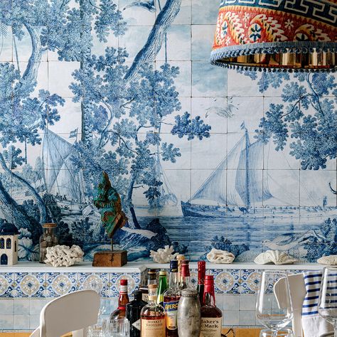 A mesmerising statement mural full of vibrant details showing a scenic view of the Mediterranean coast somewhere in France. Serene coastal vibes breeze through this carefully detailed work of art painted out in pristine blue inspired by ancient Mediterranean handmade tiles. This mural is supplied on one 9m roll containing 3x panels each having a size of 52cm width and 300cm in length covering up to 4.65sqm of surface. Greek Vibes, Design Yard, Ancient Mediterranean, Light Cyan, Mediterranean Coast, Scenic View, Mind The Gap, Wallpaper Direct, Handmade Tiles