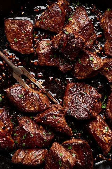 Buttery and tender, these cast iron seared steak bites are cooked to perfection and then drizzled with homemade garlic butter. Dip these juicy butter steak bites in our garlic aioli dipping sauce. Sticky Steak Bites, Top Round Steak Dinner Ideas, Chuck Roast Bites Recipes, Pork Steak Bites, Ina Garten Steak Bites, Rib Eye Steak Bites, Cast Iron Steak Bites, Tri Tip Steak Bites, Filet Bites Recipe