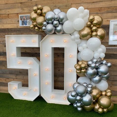 Celebrating a milestone in style! An organic balloon garland in shades of gold, silver, and white, positioned on our 4ft light up numbers are the perfect statement piece for capturing those milestone memories. Whether it’s a birthday, anniversary, or another special occasion, this setup is perfect and fits most spaces in venues or at home. Venue - @cliffhousebarton #balloonsetups #balloonsdecoration #balloons2buisness #balloons🎈 #birthdayballoons🎈 #balloonsforalloccasions #50thanniversa... Light Up Numbers, Balloon Displays, Balloon Display, Balloon Crafts, 5 Year Anniversary, Business Party, Shades Of Gold, Balloon Garland, Birthday Balloons