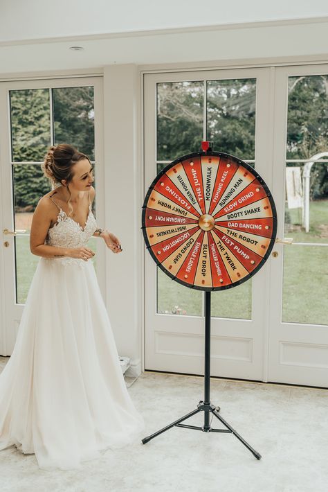 Wedding Game Ideas Spin The Wheel Rebecca Carpenter Photography #wedding #weddinggame Wedding Game Ideas, Office Props, Quirky Wedding Ideas, Bridal Chair, Hoop Decor, Carpenter Photography, Wedding Car Hire, Wedding Game, Quirky Wedding