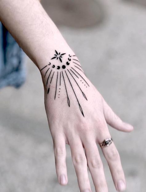 76 Hand Tattoos For Women with Meaning - Our Mindful Life Hippy Hand Tattoos For Women, Wrist And Finger Tattoos For Women, Right Left Tattoo Hand, Wrist Finger Tattoo, Hand Tattoos For Women Design, Woman’s Hand Tattoo Design, Witches Hand Tattoo, Simple Hand Tattoos For Women Unique, Tattoos On Hands For Woman