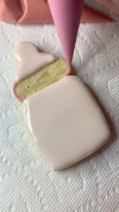 Perfect little baby bottle! 💕✨ #kizmitbakeshop #royalicingartist #mnbakery #cookier #Bakery #royalicingcookies #babyshower #babygirl #decoratedsugarcookies #MN #twincities #mnmom #babyshowercookies | Kizmit bake shop Pink Pumpkin Baby Shower Cookies, Baby Bottle Cookies Decorated, Pink Winter Wonderland Baby Shower Cookies, Pink Bow Baby Shower Cookies, Baby Bottle Cookies, Baby Rattle Sugar Cookies, Custom Treats, Pretty Desserts, Shower Cookies