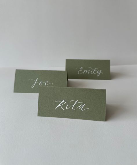 For a beautifully personalized touch, add your guests' names to your order! Email them to thoughtfullymadeuk@outlook.com or include them in the order notes at checkout.  These elegant, matte-finished, tented place cards are handcrafted with stunning calligraphy, making a memorable addition to your wedding or event decor.  Track your order (excluding samples!), with estimated dispatch times adjusted for seasonal demand.  Rush orders welcome - just send us a message. 
.#WeddingInvitations #DIYWedding #WeddingStationery #WeddingInspiration #WeddingPlanning Wedding Name Place Cards Elegant, Folded Name Cards Wedding, Calligraphy Table Names, Seating Plan Design, Handmade Wedding Place Cards, Name Tag Wedding Table Seating Charts, Namecard Wedding Table, Name Tag Table Setting, Guest Cards Wedding