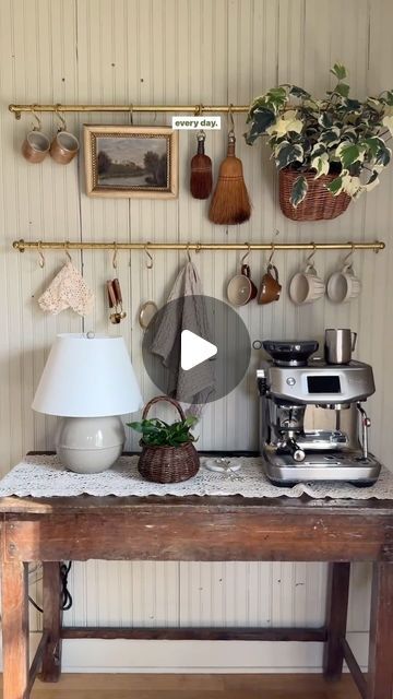 christine higgs on Instagram: "Decorate my coffee bar with me! This little area has easily become one of my favorite corners of my home and a space I look forward to using every day 🤎☕️ brass rails are from @devolkitchens!" Tree House Kitchen, Cottage Core Coffee Bar, Coffee Cup Hanging Ideas, Cottage Coffee Bar, Cottage Core Kitchen, Coffee Area, Kitchen Board, House Hunters, Cottage Core