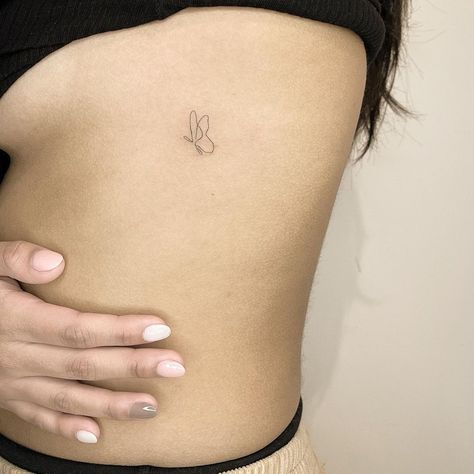 Continuous Line Tattoos, Minimalist Butterfly Tattoo, Tiny Butterfly Tattoo, Continuous Line Tattoo, Small Rib Tattoos, Minimalist Butterfly, Rib Tattoos For Women, Small Butterfly Tattoo, Hip Tattoos Women