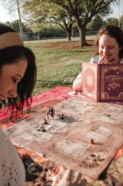 Dungeons and dragons engagement photos Dungeons And Dragons Senior Pictures, Nerdy Couple Photoshoot, Dungeons And Dragons Photoshoot, Nerd Engagement Photos, Medieval Engagement Photos, Dnd Engagement Photos, Board Game Engagement Photos, Nerdy Engagement Photos, Dnd Couple