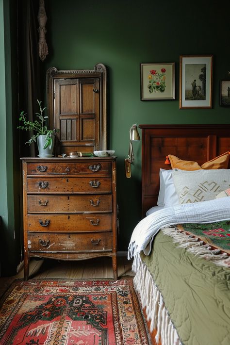 Cozy sage green bedroom featuring vintage wooden furniture, lush textiles, and sage green walls for a calming ambiance. Dark Green Walls Bedroom Aesthetic, Dark Green Master Bedrooms Decor Cozy, Sage Green And Dark Wood Bedroom, Green Bedroom Cottagecore, Dark Academia Bedroom Green, Dark Brown And Green Bedroom, Green Vintage Room, Green And Mustard Bedroom, Sage And Rust Bedroom