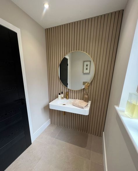 Embrace style in your small downstairs bathroom with our waterproof Slat Wall panelling! Say goodbye to water damage and re-grouting and hello to a stunning, hassle-free space💧✨ Downstairs Toilet Wood Panelling, Small Downstairs Toilet Panelling, Wooden Slat Wall Interiors Bathroom, Wall Cladding Bathroom, Slat Wood Bathroom, Wood Panel Toilet Wall, Wooden Panneling Design Wall Bathroom, Bathroom Slat Wall Ideas, Modern Bathroom Panelling