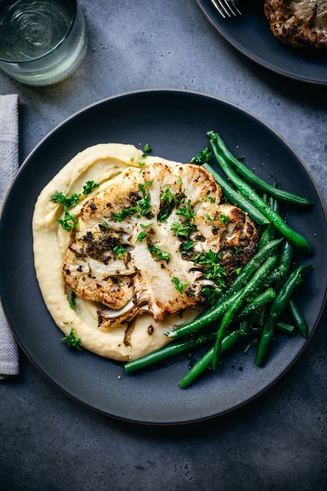 These flavorful oven roasted cauliflower steaks make for a delicious vegan/vegetarian main dish for Thanksgiving, Christmas or any other entertaining occasion! Vegetarian Main Dish, Cauliflower Steak, Roasted Cauliflower Steaks, Oven Roasted Cauliflower, Crowded Kitchen, Drink Inspiration, Vegan Roast, Xmas Dinner, Cauliflower Steaks