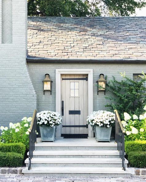 light blue gray brick and large planters Front Door Planters, Painted Brick Exteriors, Door Planter, Painted Brick House, Beautiful Front Doors, Brick Ranch, Brick Exterior House, Front Steps, Modern Farmhouse Exterior