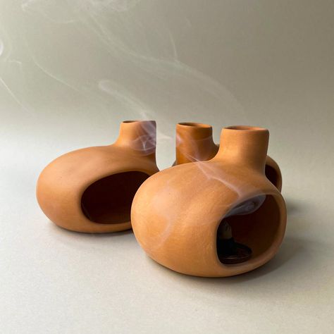 We designed and produced Mini Chiminea, which draws attention with its minimalist and modern incense function, to emit aromatic scents and energy cleansing for house that will allow you to focus while meditating! #PaloSantoHolder #ConeIncenseChiminea #CeramicPaloSantoBurner #MeditationGift #HandmadeModernCeramic #ChimneyIncenseBurner #TabletopFireplace Mini Chiminea, Tabletop Fireplaces, Cone Incense, Energy Cleansing, Energy Cleanse, Meditation Gifts, Handmade Modern, Incense Burner, Incense